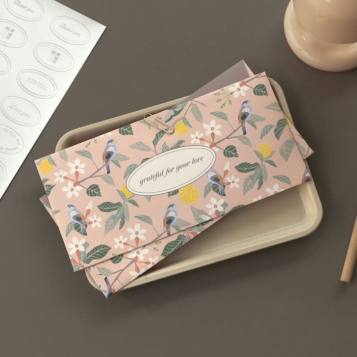 The Journal Shop - Pink floral Iconic Fortune Envelope displayed beside matching white envelope stickers.