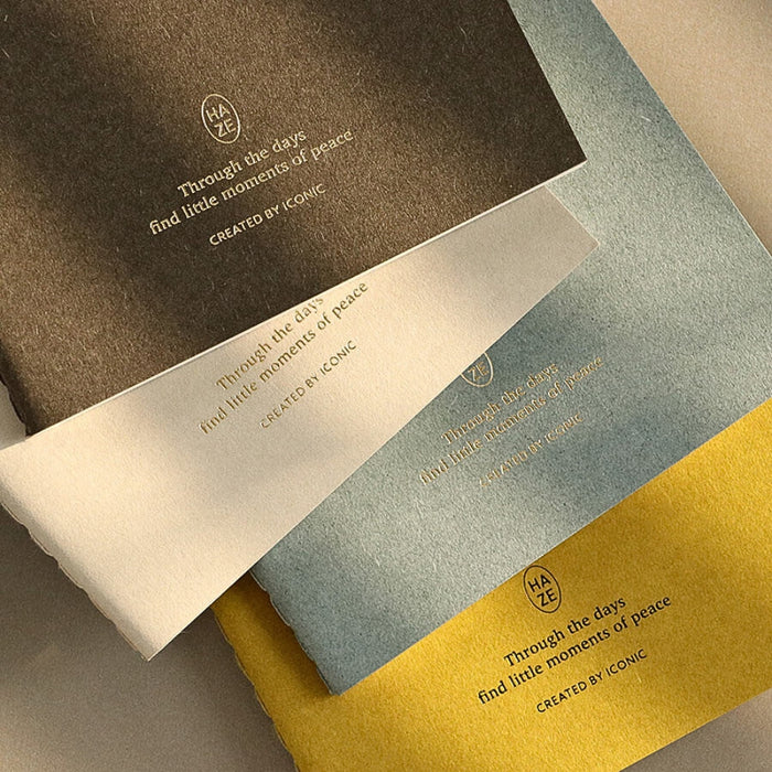 Close-up of Iconic Haze pocket notebook covers showing muted colour palette.