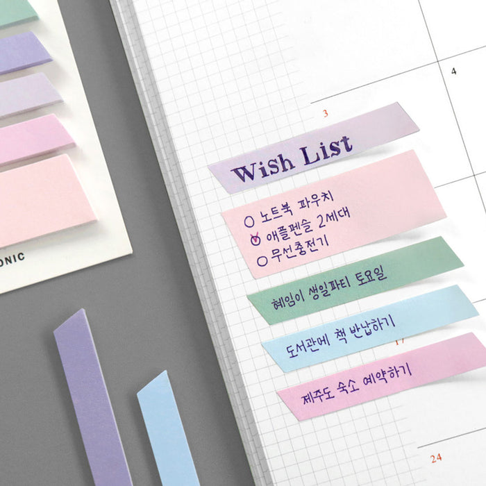 The Journal Shop - Sticky notes with pastel shades attached to planner pages for scheduling and highlighting.