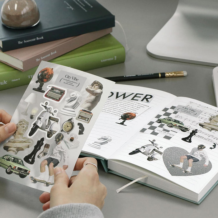 The Journal Shop - Open planner decorated with Iconic Just Object Stickers and stationery items beside it.