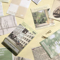 The Journal Shop - Sheets of Moodscape stickers with travel and cityscape designs spread out on a yellow desk.