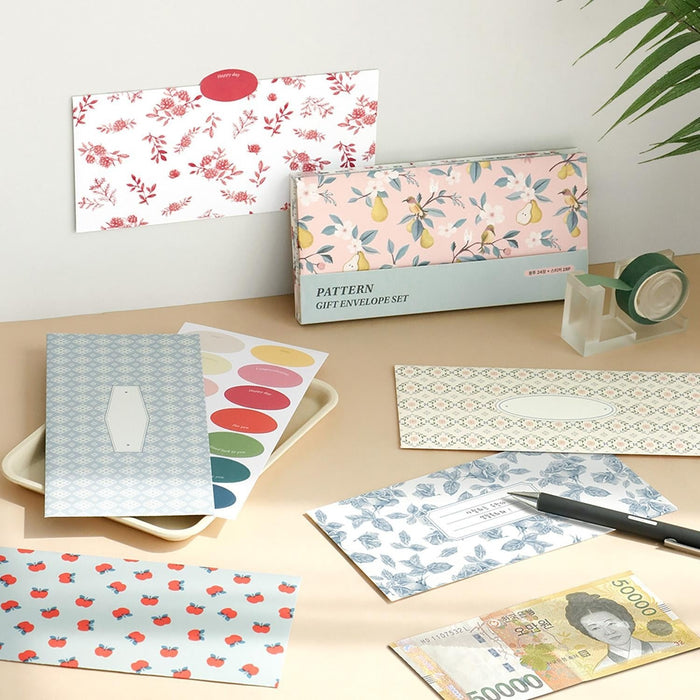 The Journal Shop - Floral and patterned Iconic Pattern Envelopes displayed beside coordinating stickers and stationery on a light desk.