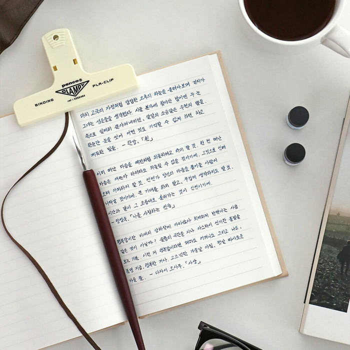 The Journal Shop - Iconic Solitude Tomoe River Line Notebook open on desk with pen and handwritten notes.
