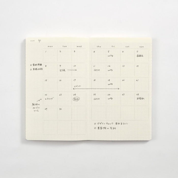 Open Daigo Isshoni Day Log B6 Slim Notebook displaying schedule and note layout.