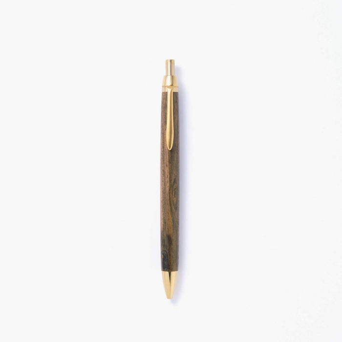 The Journal Shop - Kakimori Handcrafted Ballpoint Pen with polished wooden barrel and gold-toned clip displayed on a white background.