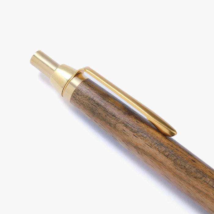 The Journal Shop - The Journal Shop -  Angled view of the Kakimori Handcrafted Ballpoint Pen highlighting the golden nib and clip.
