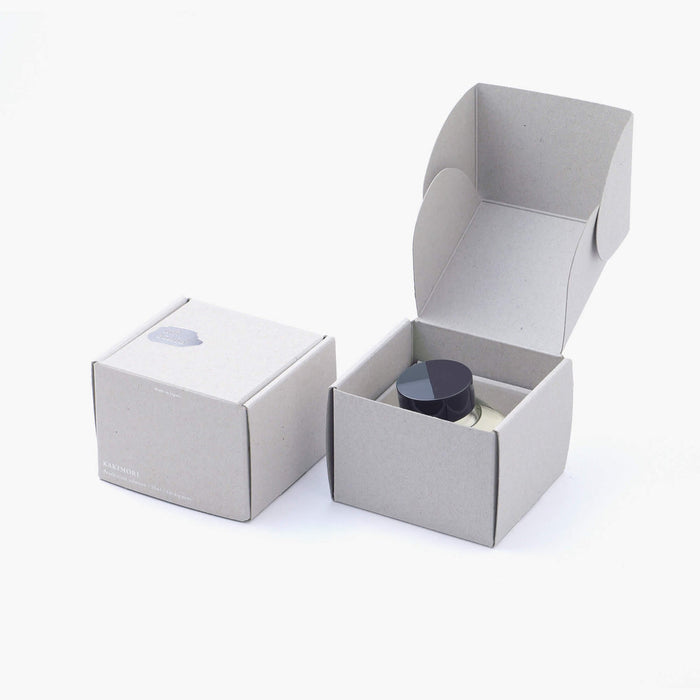 The Journal Shop -  Kakimori Pearlescent Solution bottle presented inside its grey gift box with secure inner packaging.