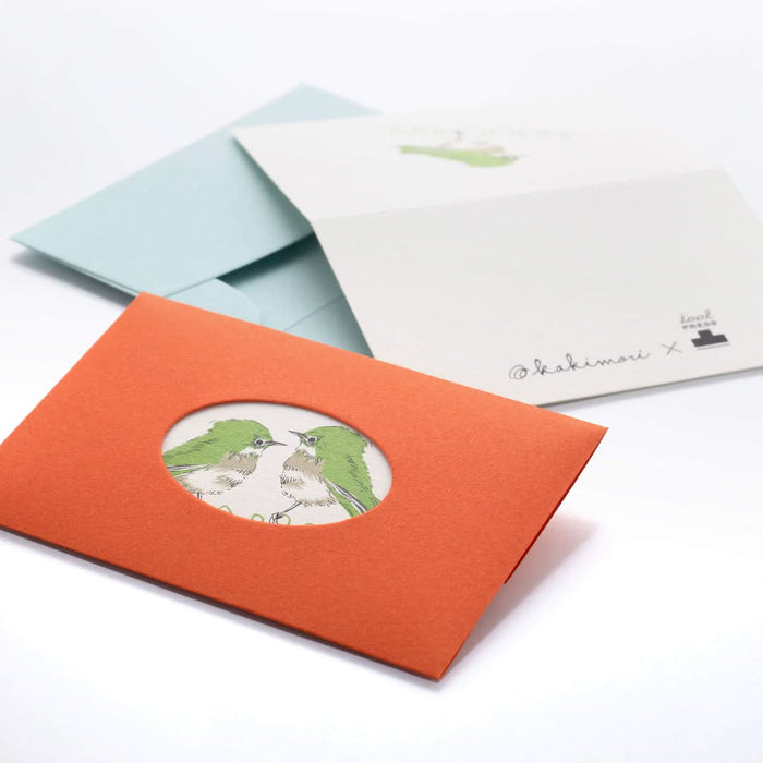 The Journal Shop - Open envelopes and cards from the Kakimori Spring Bird set showing delicate green bird motifs.