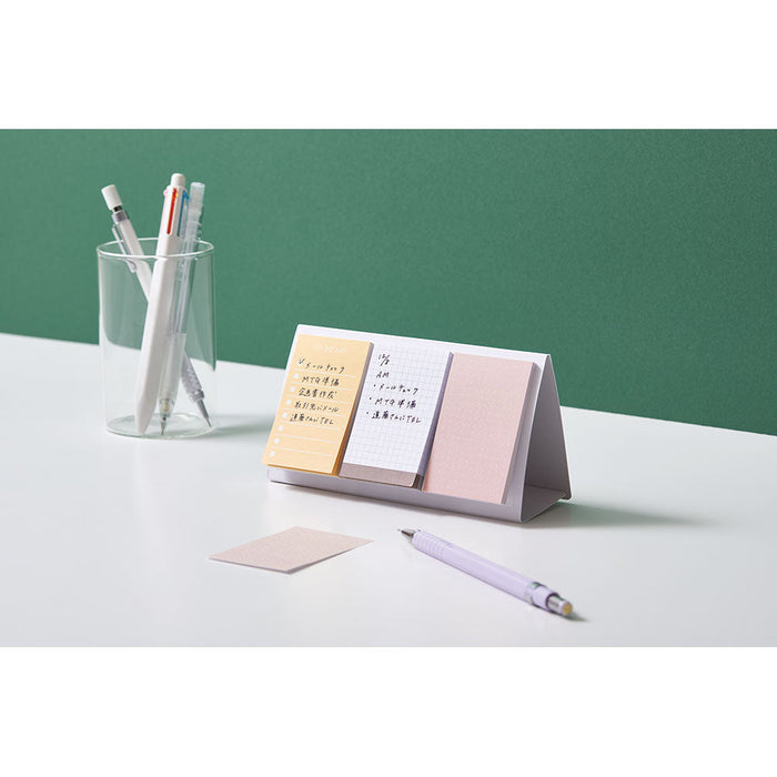 EMILY Fusen sticky notes styled on a minimal desk setup with stationery.