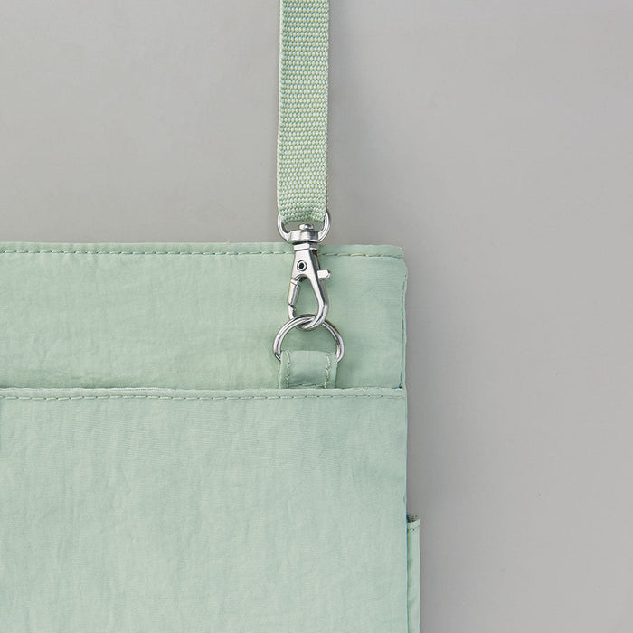 Close-up of the zip fastening and fabric texture of the EMILY work pouch.