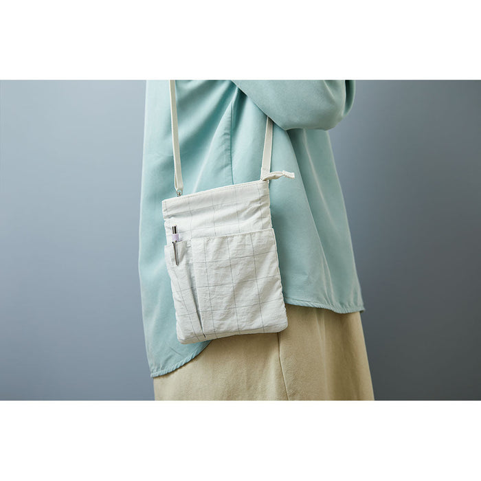 EMILY work pouch worn over the shoulder, showing size and proportions when carried.