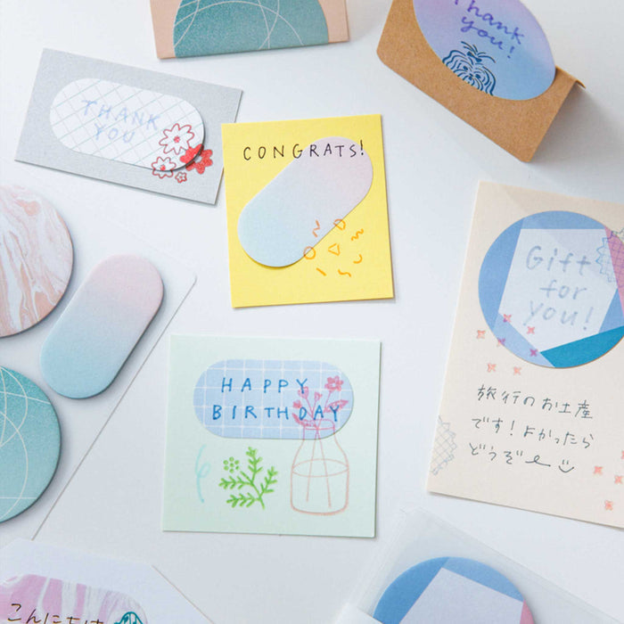 Assorted HITOTOKI Coffret cosmetic sticky notes displayed in coordinated pastel tones.