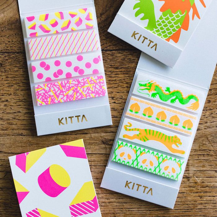Packaged KITTA special washi stickers arranged neatly on a wooden surface.