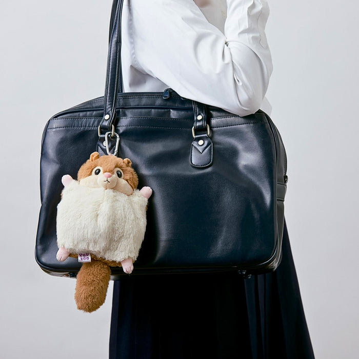 Side view of the Pouzoo momonga animal design mini pouch highlighting plush shape.