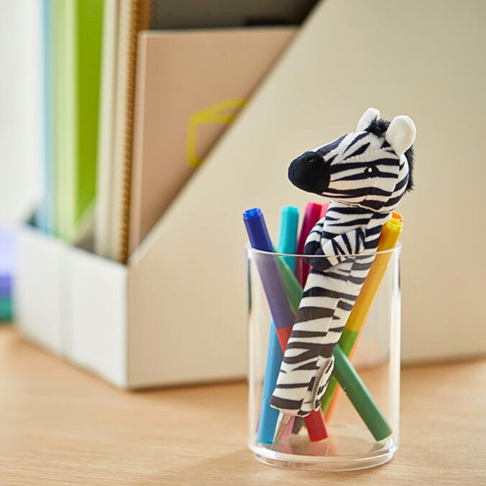 Zebra Pouzoo pen grip attached to a pen inside a stationery storage glass.