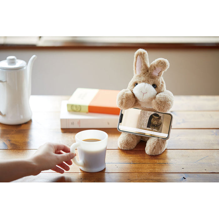 Pouzoo rabbit animal design pen pouch placed on a desk with stationery and books.