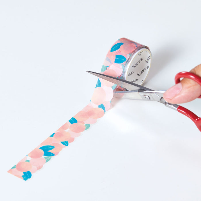 Hand unrolling SODA die-cut masking tape showing the 20mm decorative pattern.