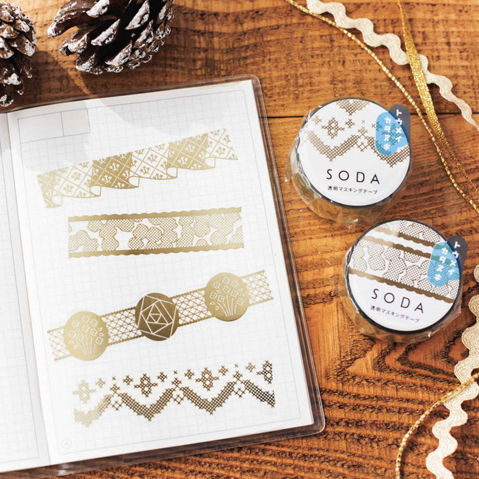 SODA foil and die-cut masking tape arranged on a journal page with decorative stationery.