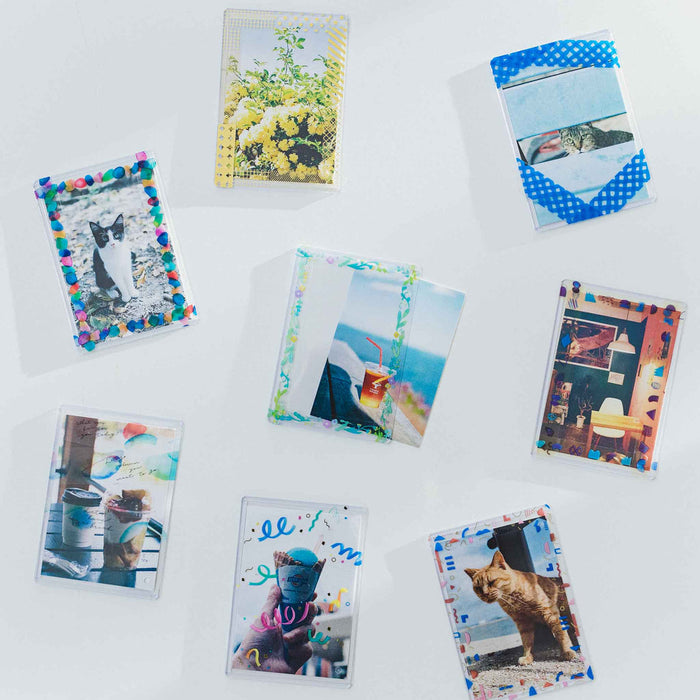 Mini photographs and cards displayed using SODA foil masking tape on a desk.