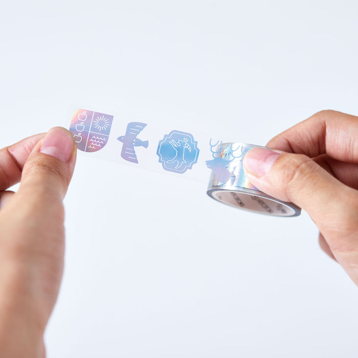 Hand tearing a strip of SODA foil masking tape, showing flexible 20mm width.