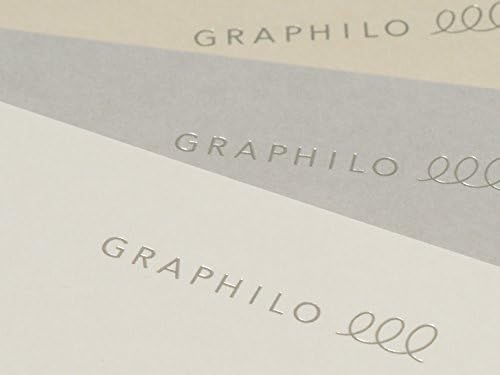 Close-up view of GRAPHiLO 000 notebook covers with embossed silver logos.