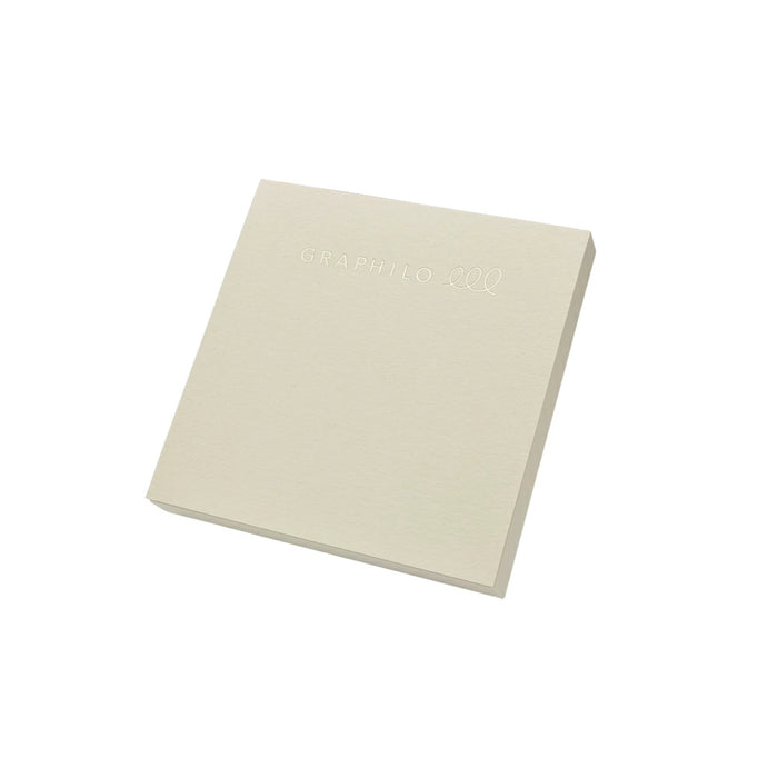 Angled view of GRAPHiLO note pad showing cover with embossed logo.
