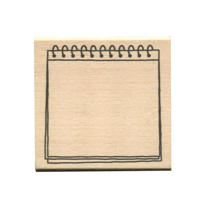 Wooden stamp with a spiral notebook frame design, ideal for bullet journaling or planners. Measurements: 45 x 45 x 24mm.