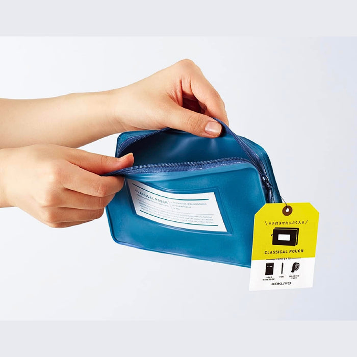 Hand opening Kokuyo Classical pen pouch to show zip fastening and interior space.