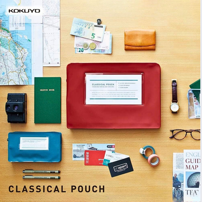 Kokuyo Classical pen pouch laid flat with everyday stationery items.