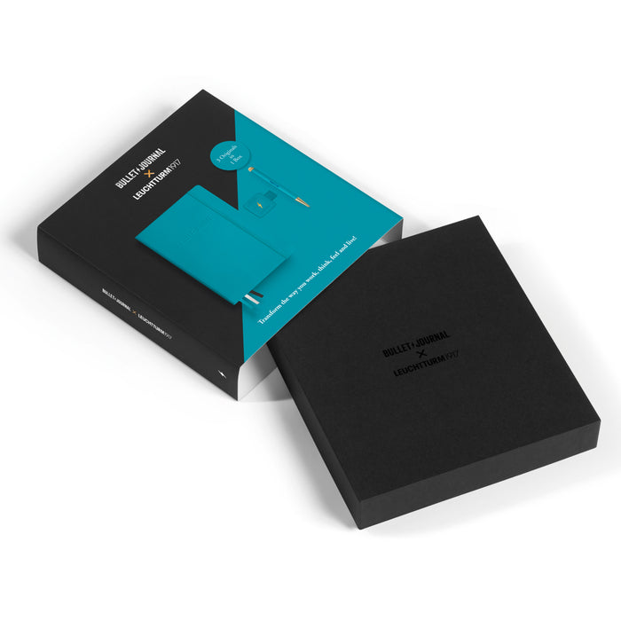 Unboxed Leuchtturm1917 Bullet Journal Gift Set in Turquoise25 with notebook and accessories displayed inside the packaging.