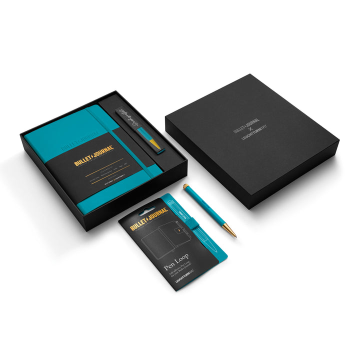 Contents of the Leuchtturm1917 Bullet Journal Gift Set in Turquoise25 arranged neatly, including notebook, guides, and accessories.
