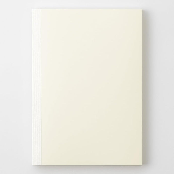 Midori MD Notebook A5 Grid closed showing simple cream paperback notebook design.