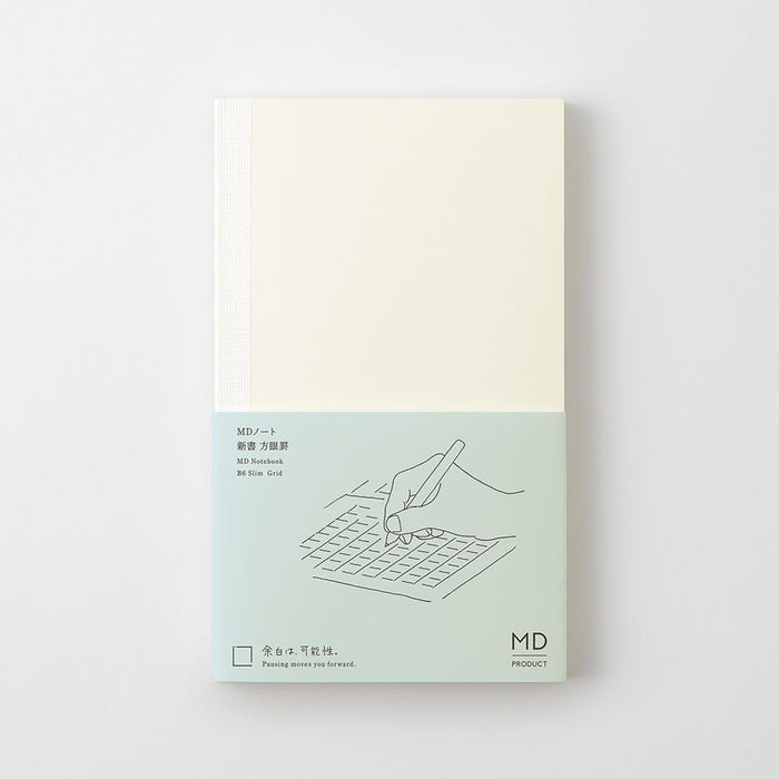 Midori MD Notebook Shinsho B6 Slim Grid with minimalist cream cover and subtle MD branding.