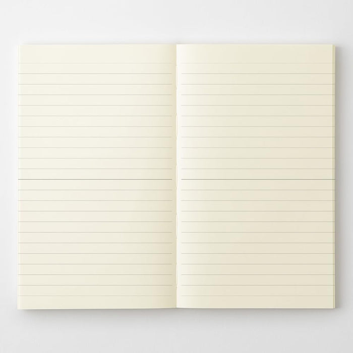 Midori MD Notebook Shinsho B6 Slim Lined opened flat displaying neatly ruled pages.