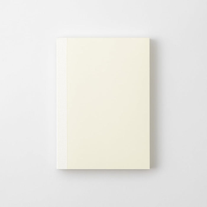 Midori MD Notebook Paperback A6 Grid closed showing simple cream paperback notebook design.