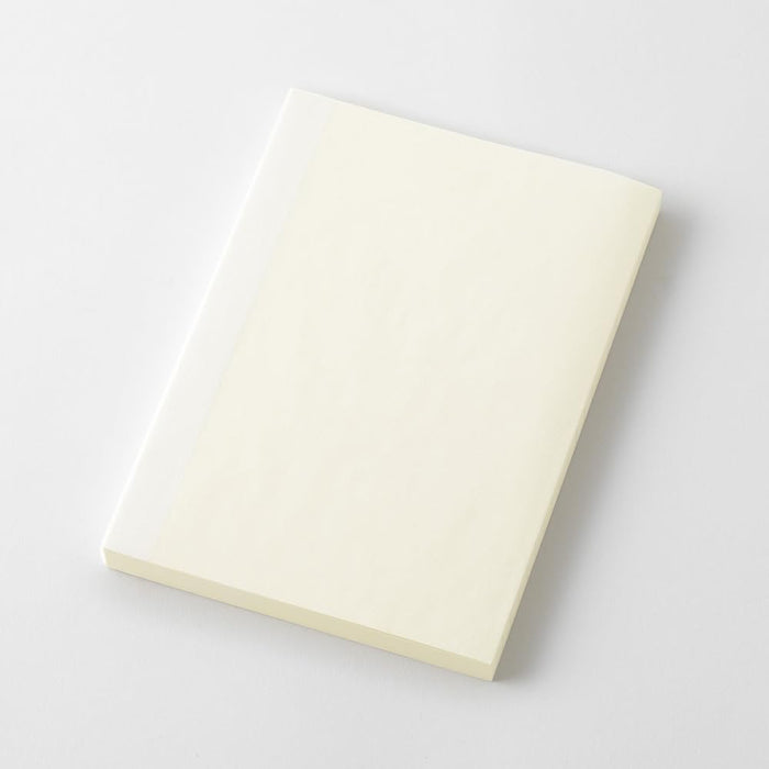 Midori MD Notebook Paperback A6 Grid placed at an angle highlighting slim paperback design.