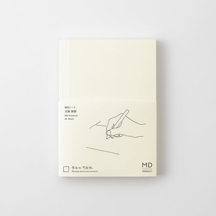 Midori MD Notebook Paperback A6 Plain with minimalist cream cover and subtle MD branding.