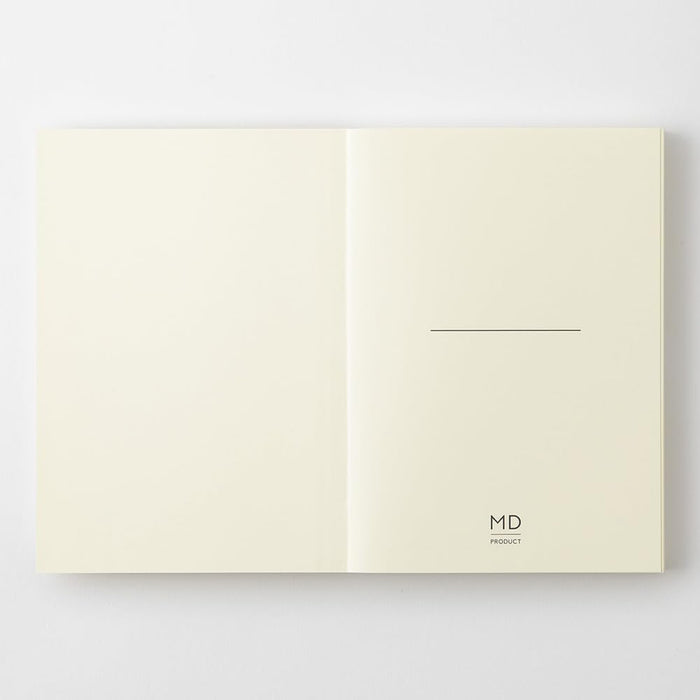Midori MD Notebook Paperback A6 Plain opened flat displaying smooth blank pages.
