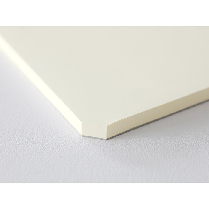 Corner detail of Midori MD Paper Pad, showcasing the cut-edge design for easy grip.