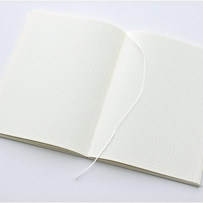 Open Midori MD Paper Notebook A5 Grid displaying grid layout pages with bookmark ribbon.