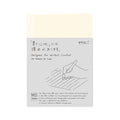 Midori MD Paper Notebook A6 Ruled with thread-stitch binding shown in original packaging with grey wrap band.