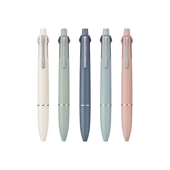 The Journal Shop - Five Mitsubishi Jetstream Lite Touch Ink multi-function pens arranged in a row, featuring matte pastel barrels in white, grass green, steel blue, mist blue, and coral pink.