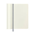 Open Moleskine notebook showing plain cream pages, ideal for sketching or writing.