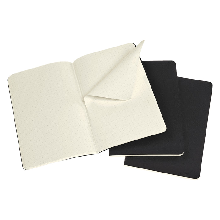 Open Moleskine Large Black Cahier Dotted notebook showing cream dotted pages.