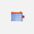Papier Tigre Mesh Pocket Extra Small in peach-cobalt holding cards.
