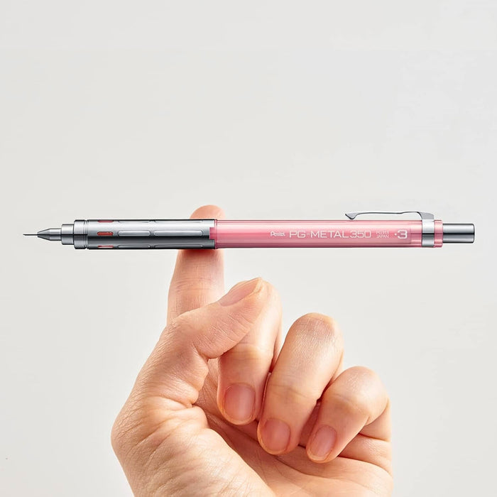 Pentel Metal 350 mechanical pencil balanced on fingertip showing lightweight metal body.