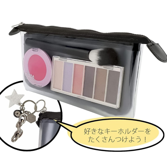 Sunstar Clear Pouch Mitte Flat Light in black filled with makeup items.