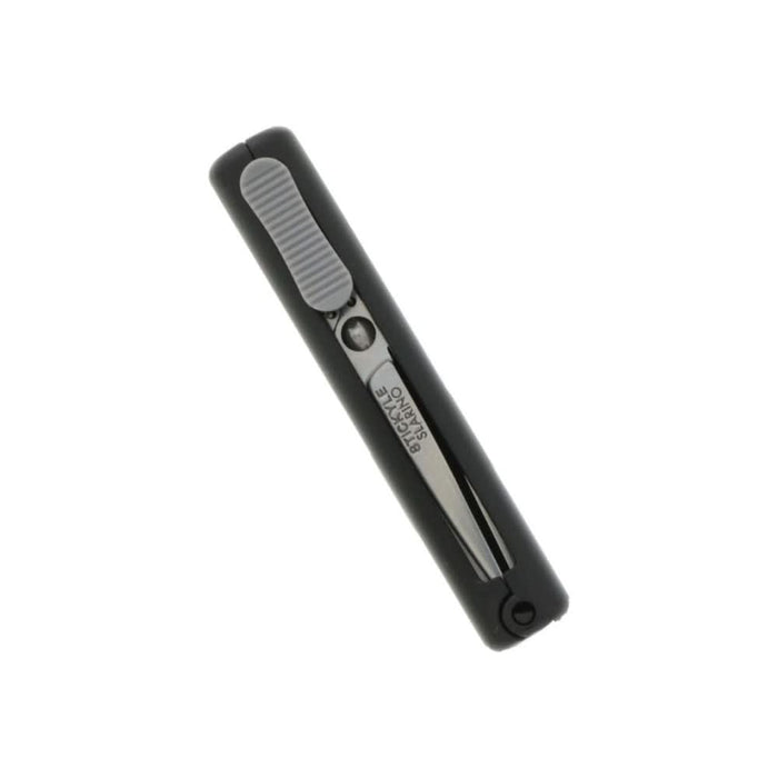 Sun-Star Stickyle Slarino black retractable compact scissors laid flat, blades fully retracted.