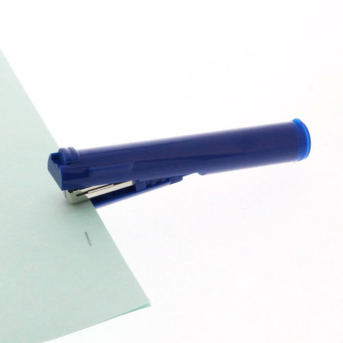 Blue Sun-Star Stickyle stapler stapling a sheet of paper, demonstrating its compact design.