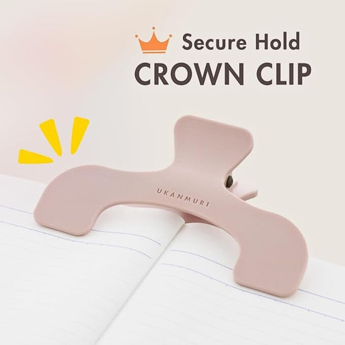 Sun-Star Ukanmuri Clip in peach beige holding open a notebook with “Secure Hold Crown Clip” text overlay.